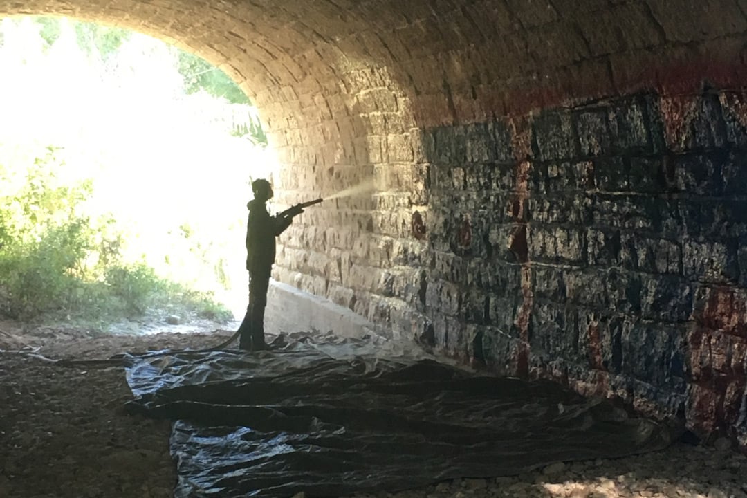 blasting graffiti from a bridge dustless blasting