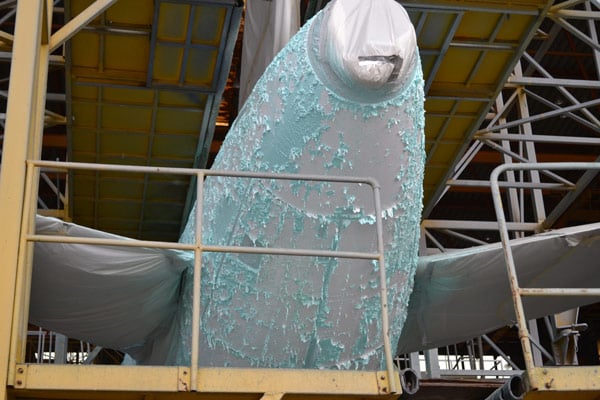 chemical paint stripping on an airplane