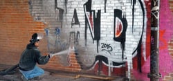 removing graffiti from brick wall