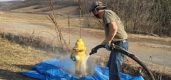 blasting paint from yellow fire hydrant