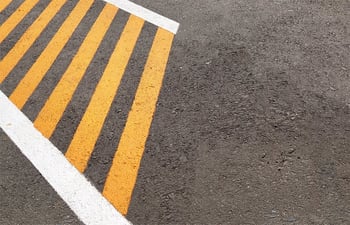 yellow and white pavement markings