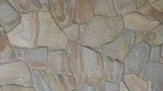 Natural stone wall after latex paint removal