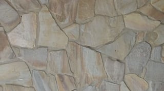 Natural stone wall after latex paint removal