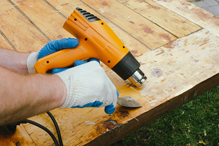 hand-removing-old-paint-from-wood-using-scraper-a-2025-01-09-07-02-37-utc-1
