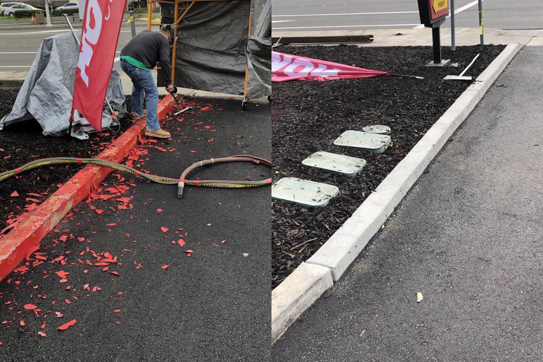 flaking red paint stripped from curb